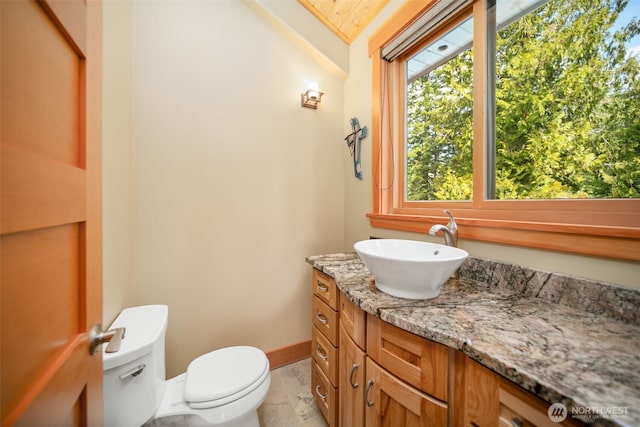 17650 Roaring Creek Rd, Leavenworth, WA 98826 - bathroom featuring toilet, vanity, and baseboards