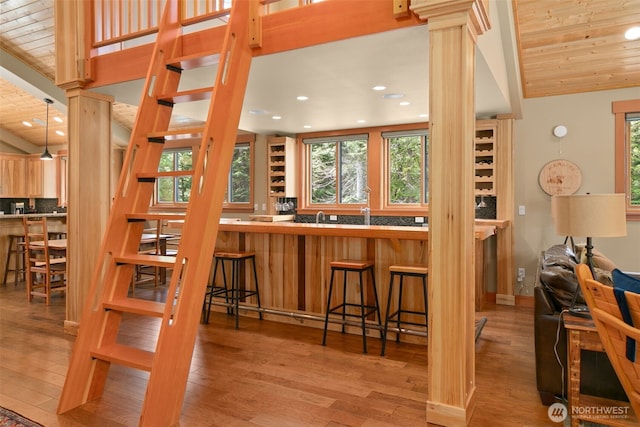 17650 Roaring Creek Rd, Leavenworth, WA 98826 - kitchen with wood finished floors, decorative columns, wooden ceiling, and recessed lighting