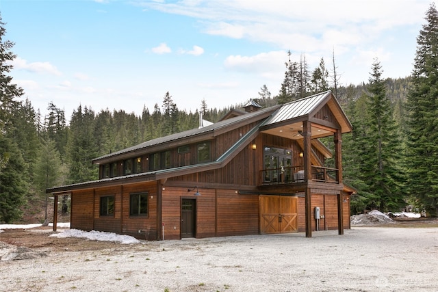 17650 Roaring Creek Rd, Leavenworth, WA 98826 - view of front of home featuring metal roof and a view of trees