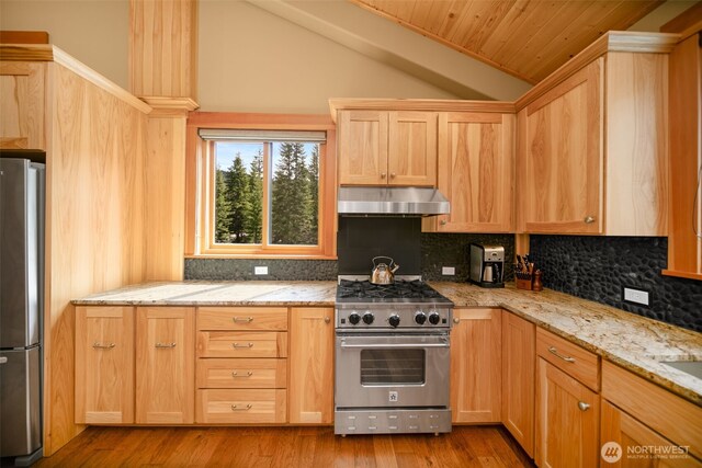 17650 Roaring Creek Rd, Leavenworth, WA 98826 - kitchen featuring tasteful backsplash, light brown cabinets, lofted ceiling, appliances with stainless steel finishes, and ventilation hood