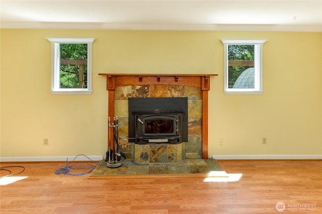 4109 S Reddick Rd, Port Angeles, WA 98363 - detailed view of ornamental molding, wood finished floors, and a wood stove