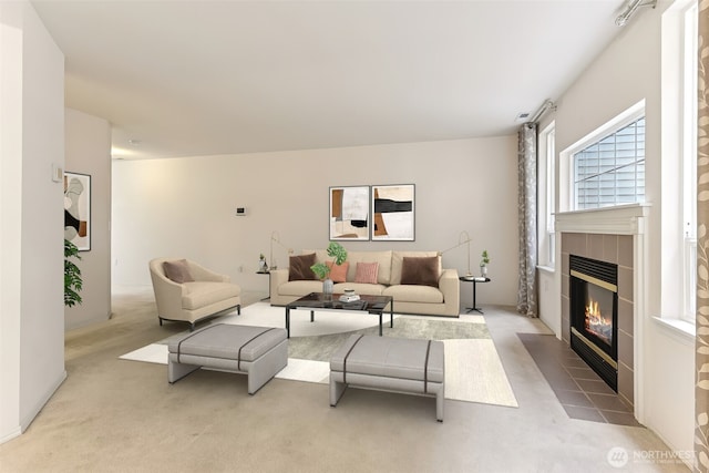 carpeted living room featuring a fireplace