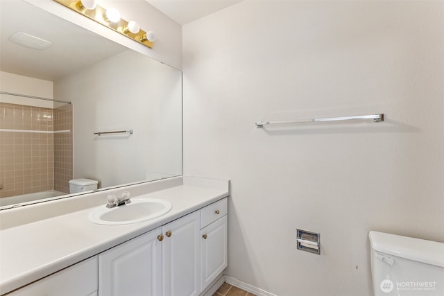 full bath with a shower, vanity, and toilet