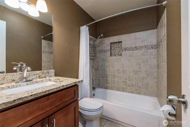 bathroom featuring tile patterned flooring, shower / tub combo, vanity, and toilet