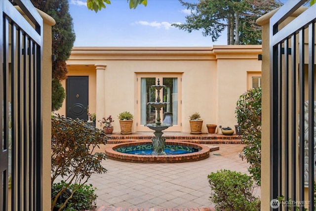 doorway to property with stucco siding