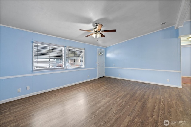 unfurnished room featuring ornamental molding, baseboards, a ceiling fan, and wood finished floors