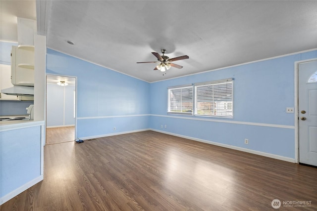 unfurnished living room with crown molding, ceiling fan, wood finished floors, lofted ceiling, and baseboards