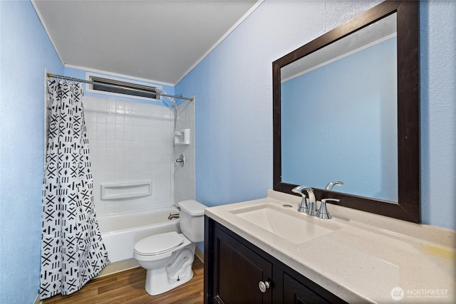 bathroom with vanity, ornamental molding, shower / bath combo, toilet, and wood finished floors