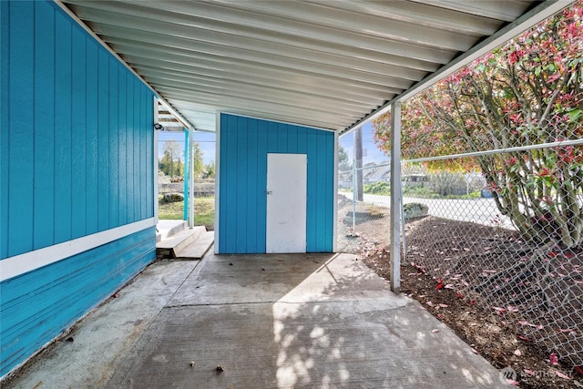view of patio / terrace featuring an outdoor structure and a storage unit