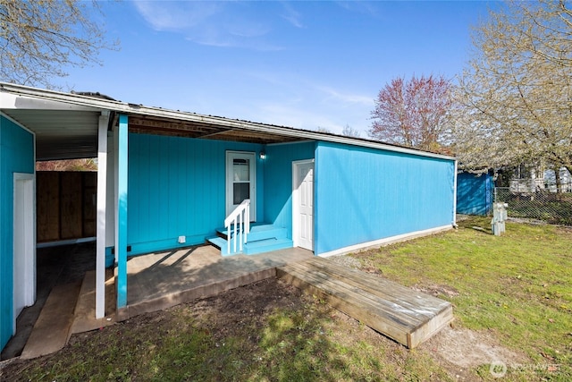 rear view of property with fence