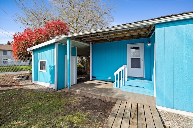 view of outdoor structure with fence