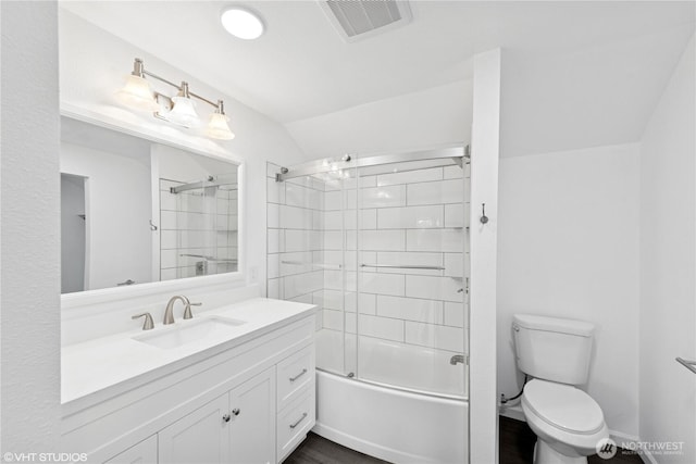 1210 Madison St, Aberdeen, WA 98520 - bathroom featuring visible vents, bath / shower combo with glass door, toilet, vanity, and wood finished floors