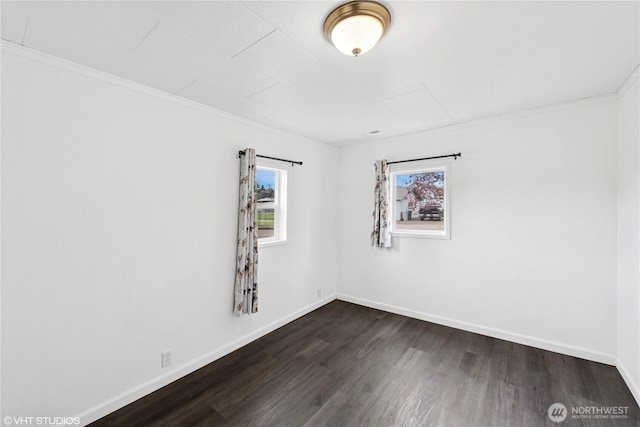 1210 Madison St, Aberdeen, WA 98520 - unfurnished room featuring dark wood-style flooring, ornamental molding, and baseboards