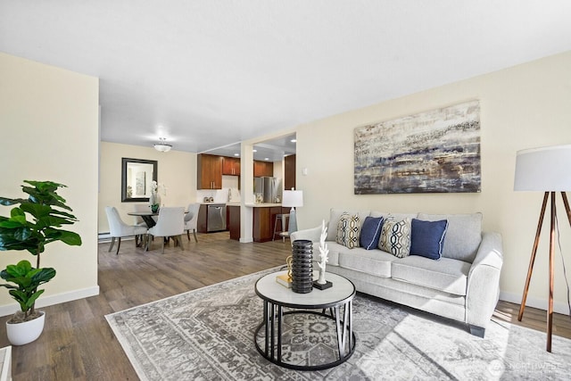 living room with dark wood-style flooring and baseboards