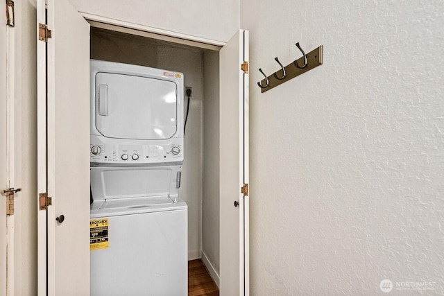 laundry area featuring laundry area and stacked washer / drying machine