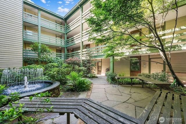 view of property's community with a patio