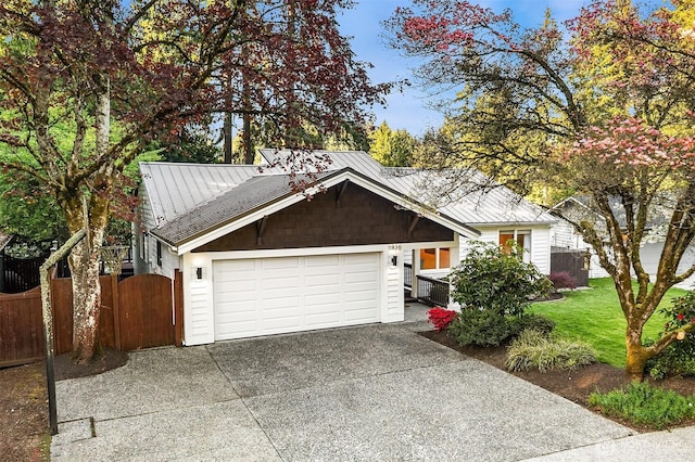 11820 NE 145th St, Kirkland, WA 98034 - view of front of house with a garage, driveway, fence, and metal roof