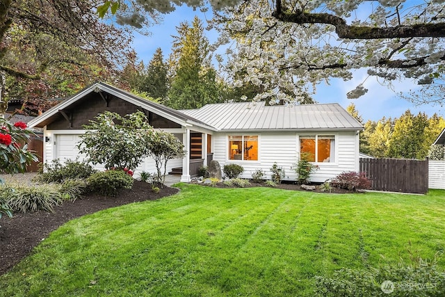 11820 NE 145th St, Kirkland, WA 98034 - ranch-style house with metal roof, an attached garage, a front lawn, and fence