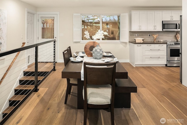 11820 NE 145th St, Kirkland, WA 98034 - dining area featuring light wood-type flooring and baseboards