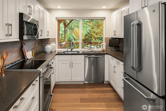 11820 NE 145th St, Kirkland, WA 98034 - kitchen featuring recessed lighting, tasteful backsplash, stainless steel appliances, and a sink
