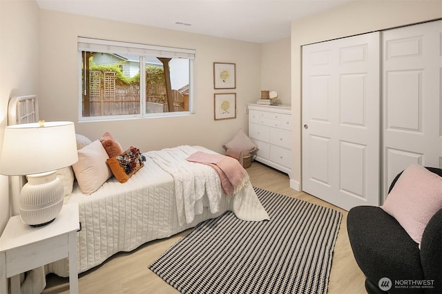 11820 NE 145th St, Kirkland, WA 98034 - bedroom featuring light wood-style floors, a closet, and visible vents
