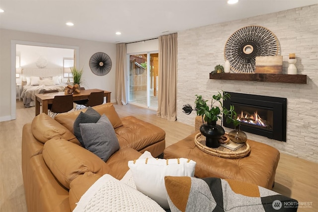 11820 NE 145th St, Kirkland, WA 98034 - living room with recessed lighting, a stone fireplace, and wood finished floors