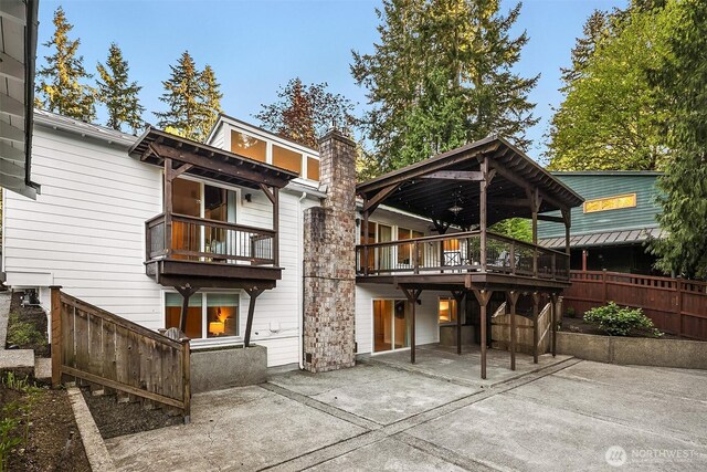 11820 NE 145th St, Kirkland, WA 98034 - back of house with a chimney, a wooden deck, fence, and a patio area