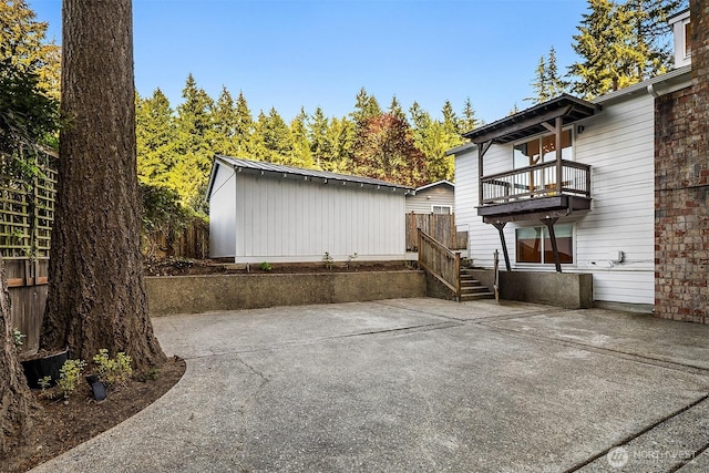 11820 NE 145th St, Kirkland, WA 98034 - view of patio / terrace featuring fence, an outbuilding, and a balcony
