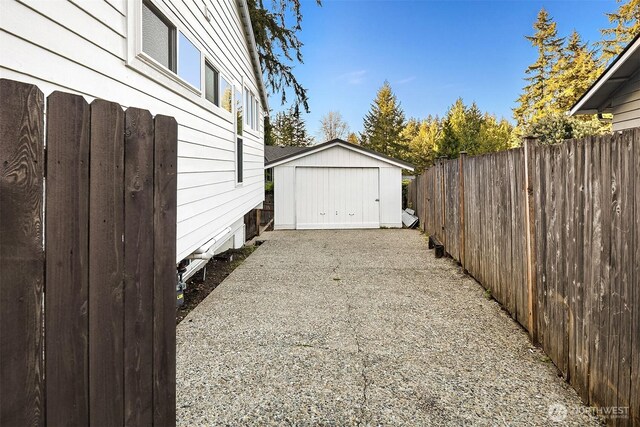11820 NE 145th St, Kirkland, WA 98034 - exterior space featuring fence, an outbuilding, and a storage unit