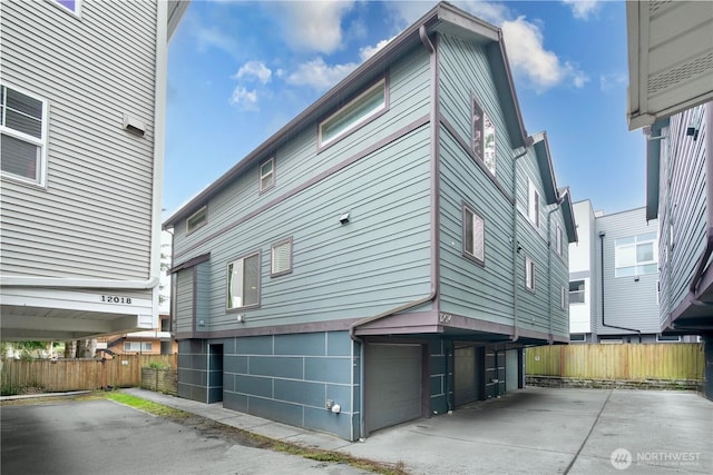 12014 31st Ave NE Unit C, Seattle, WA 98125 - view of property exterior featuring an attached garage