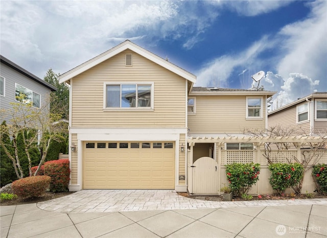 7018 117th Pl NE, Kirkland, WA 98033 - traditional-style house with an attached garage, a gate, and driveway