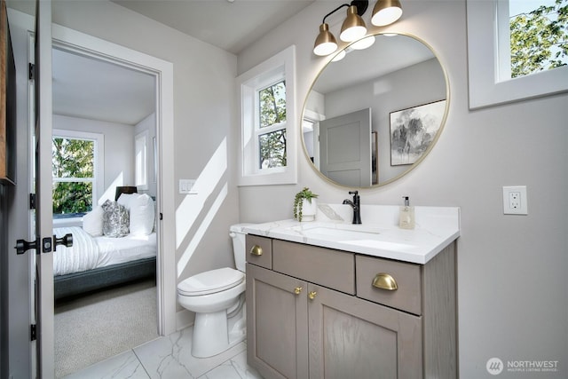 428 20th Ave, Kirkland, WA 98033 - bathroom with vanity, marble finish flooring, toilet, and ensuite bathroom