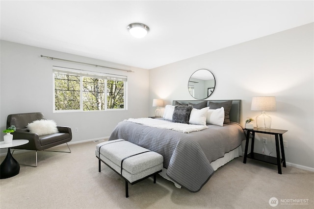 bedroom with carpet flooring and baseboards