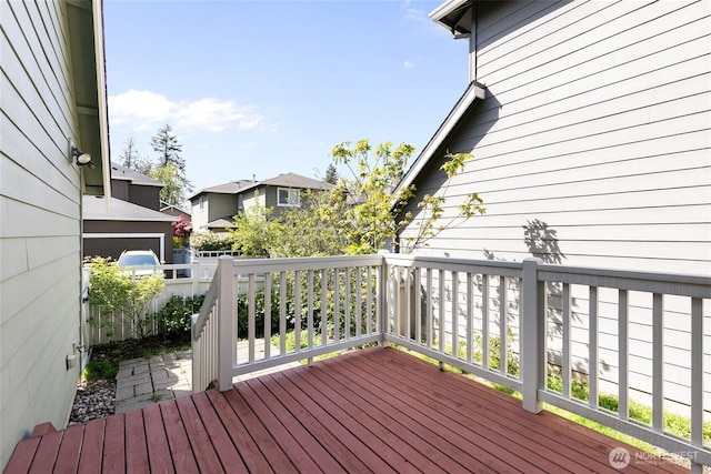 wooden terrace with a residential view