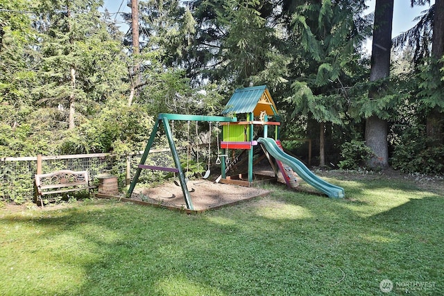 view of play area featuring a yard and fence