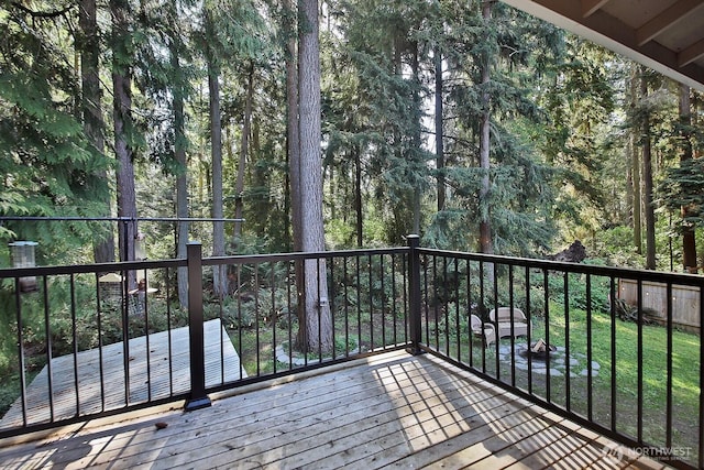 wooden terrace with a view of trees