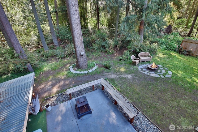 view of yard with an outdoor fire pit and a patio