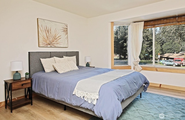 bedroom with wood finished floors