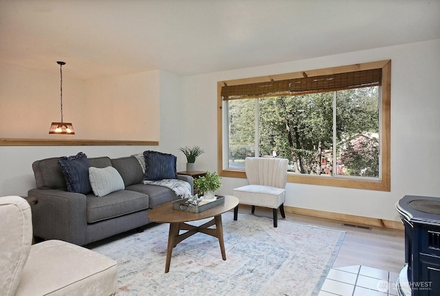 living area with visible vents and baseboards