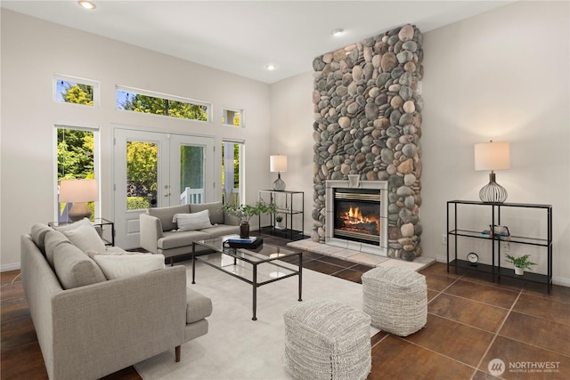 17605 244th Ave SE, Maple Valley, WA 98038 - living room featuring french doors, a fireplace, a high ceiling, recessed lighting, and baseboards