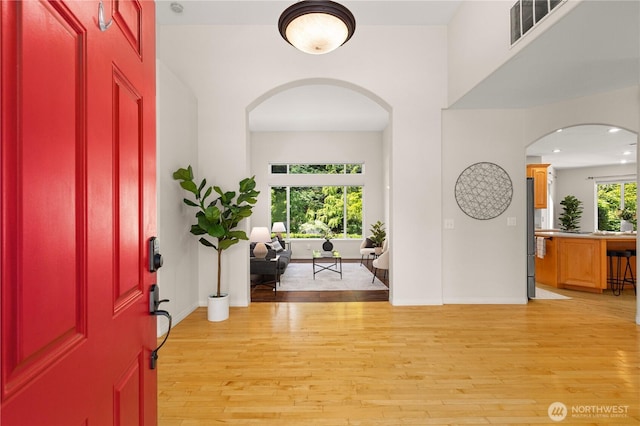 17605 244th Ave SE, Maple Valley, WA 98038 - entryway featuring light wood-style floors, arched walkways, baseboards, and recessed lighting