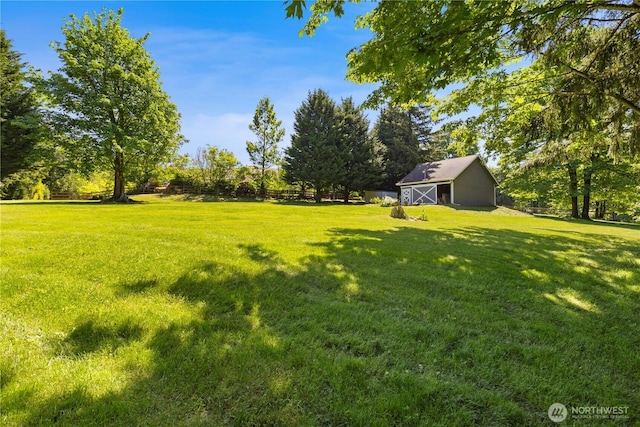 17605 244th Ave SE, Maple Valley, WA 98038 - view of green lawn with an outbuilding