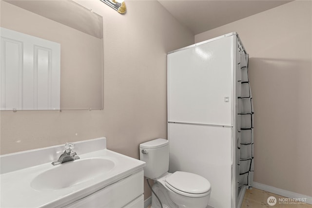 17605 244th Ave SE, Maple Valley, WA 98038 - bathroom with vanity, toilet, a shower, and baseboards
