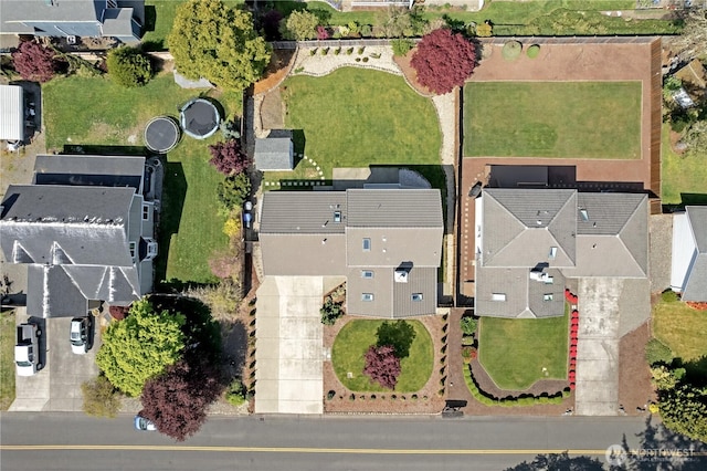 birds eye view of property with a residential view