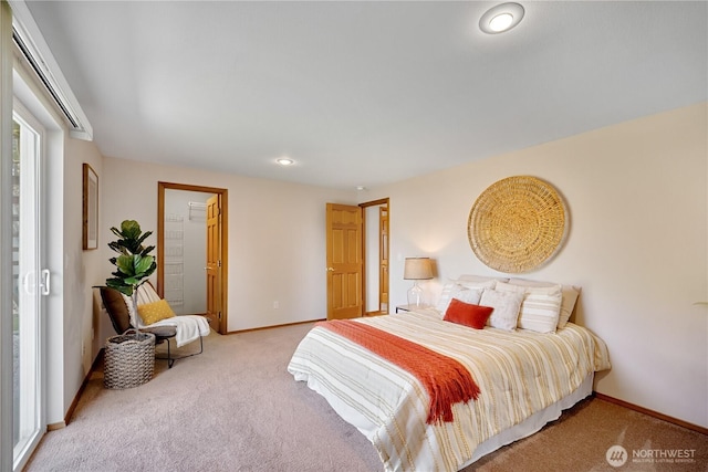 carpeted bedroom featuring baseboards