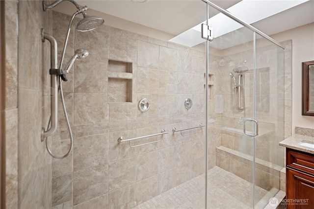 full bath featuring a shower stall and vanity