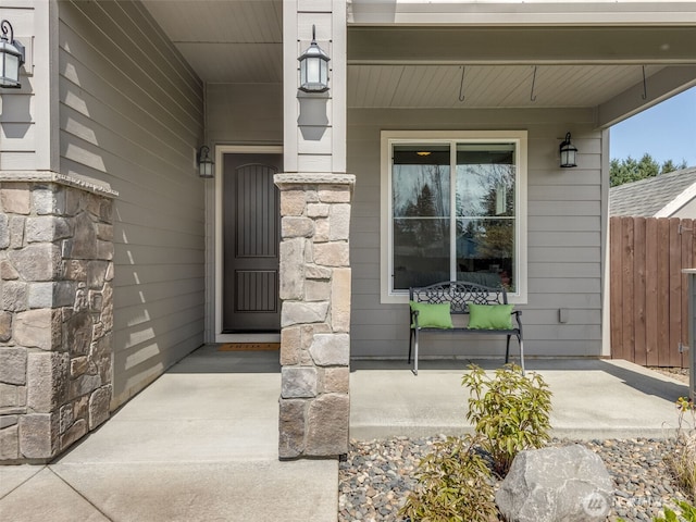 4206 NE 132nd St, Vancouver, WA 98686 - property entrance with stone siding, covered porch, and fence