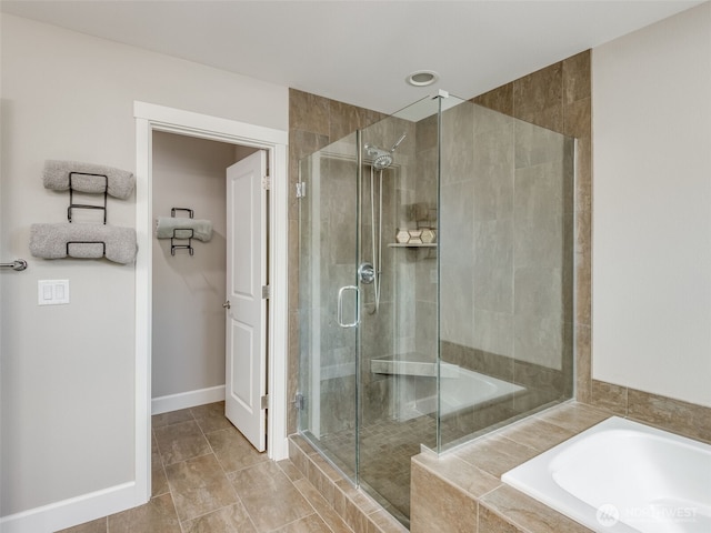 4206 NE 132nd St, Vancouver, WA 98686 - bathroom featuring a shower stall, a garden tub, and baseboards