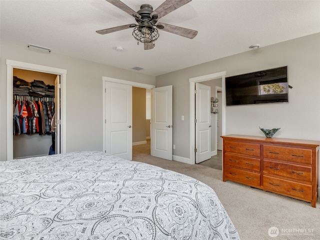 4206 NE 132nd St, Vancouver, WA 98686 - bedroom featuring a walk in closet, visible vents, carpet flooring, and ceiling fan