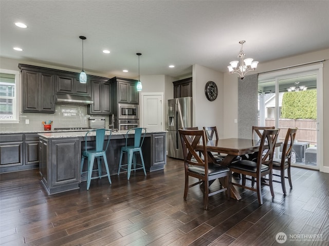 4206 NE 132nd St, Vancouver, WA 98686 - dining room featuring dark wood finished floors, an inviting chandelier, and recessed lighting